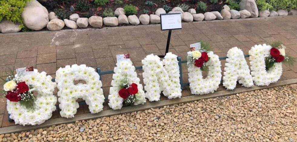 SERVICE- TRIBUTE ARRANGEMENTS Flowers